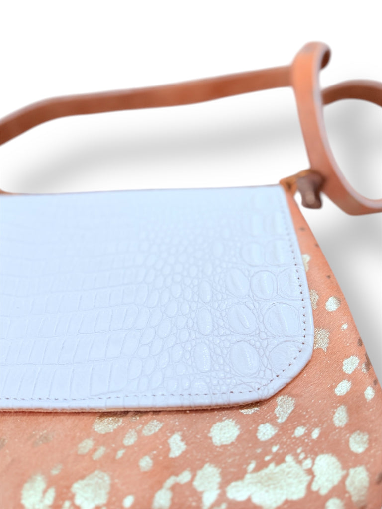 The Buckle Belle Spring White & Blushing Shimmer Hide Crossbody