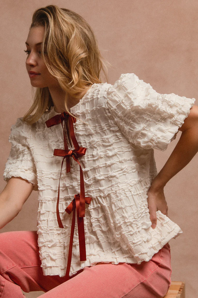 Ivory Textured Woven Peplum Bow Tie Top