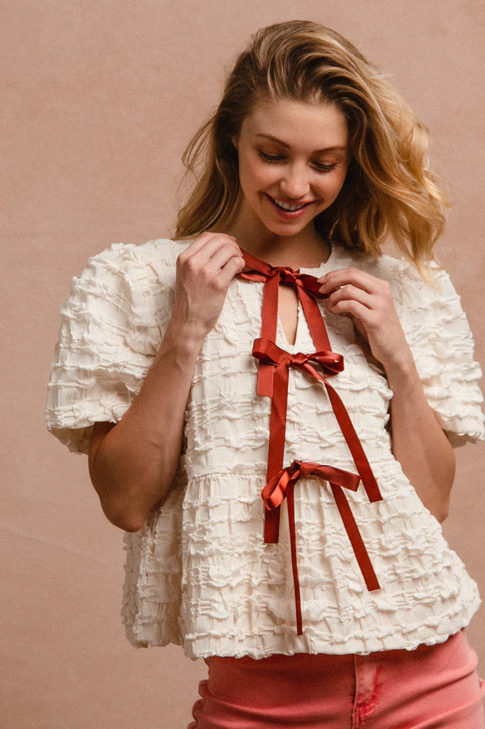 Ivory Textured Woven Peplum Bow Tie Top